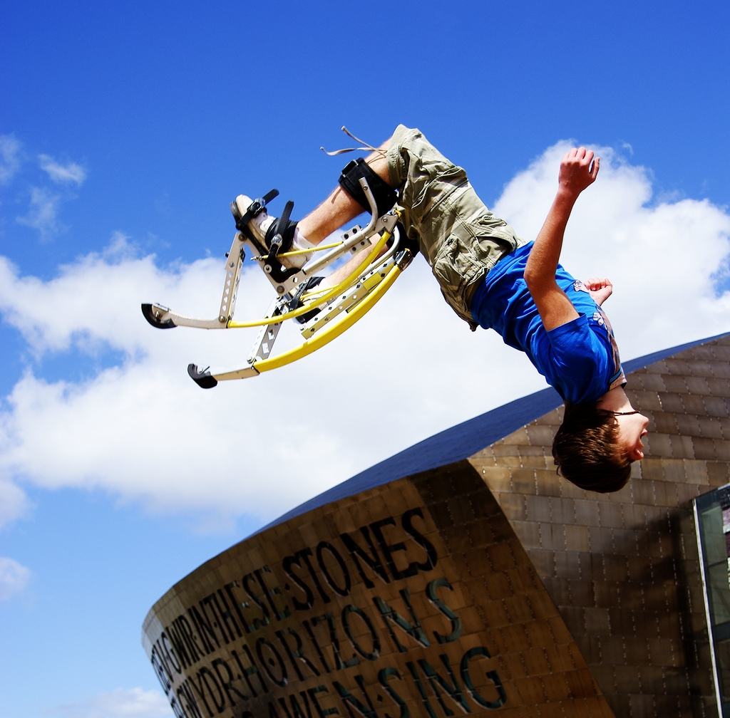 image of man wearing specialize boots doing a flip.